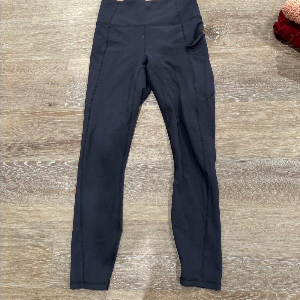 Dark gray Fabletics leggings with phone pocket
